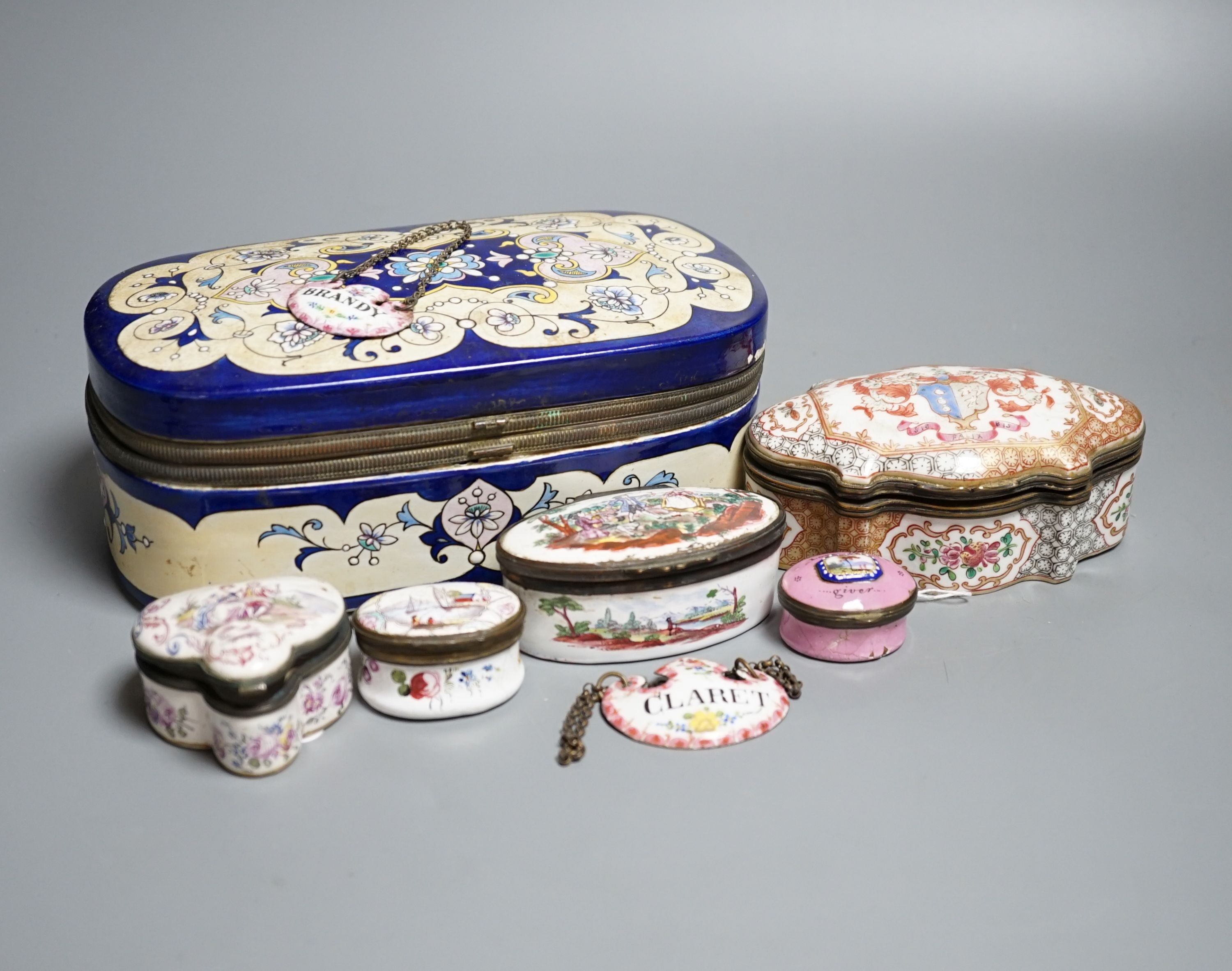 A group of five English and Continental enamel and porcelain patch and other boxes and two spirit labels, largest 20 x 8cm